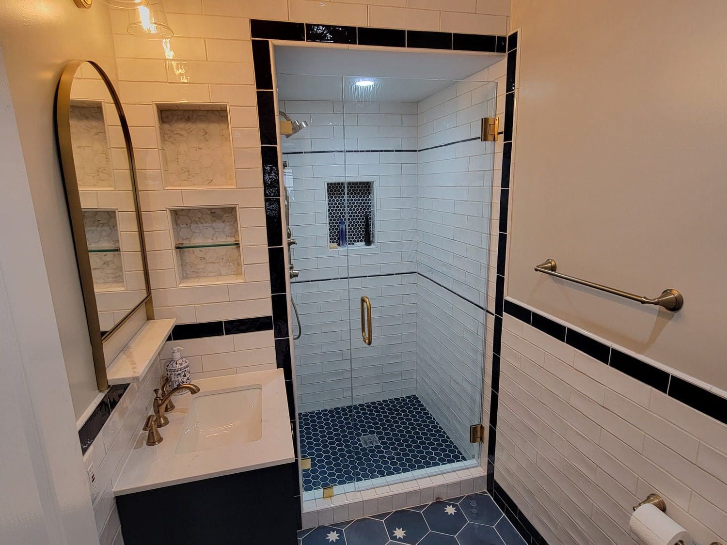 A bathroom with a shower and sink in it