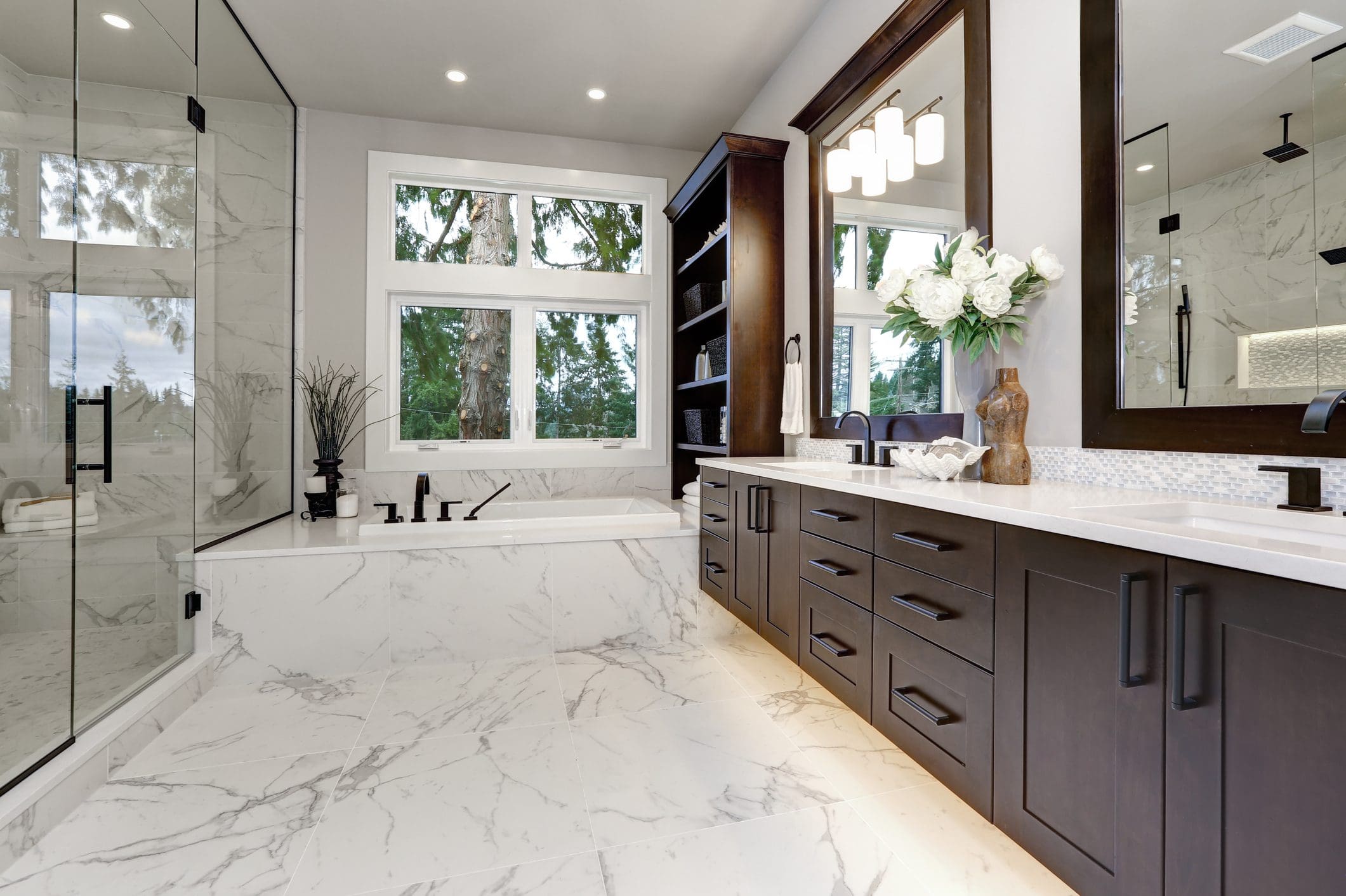 A bathroom with marble floors and walls.