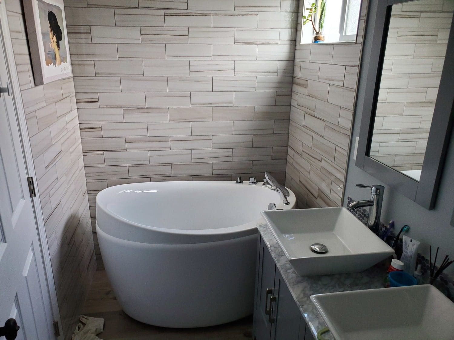 A bathroom with a tub and sink in it