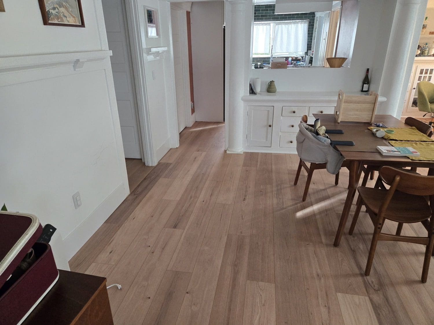 A room with wooden floors and white walls.