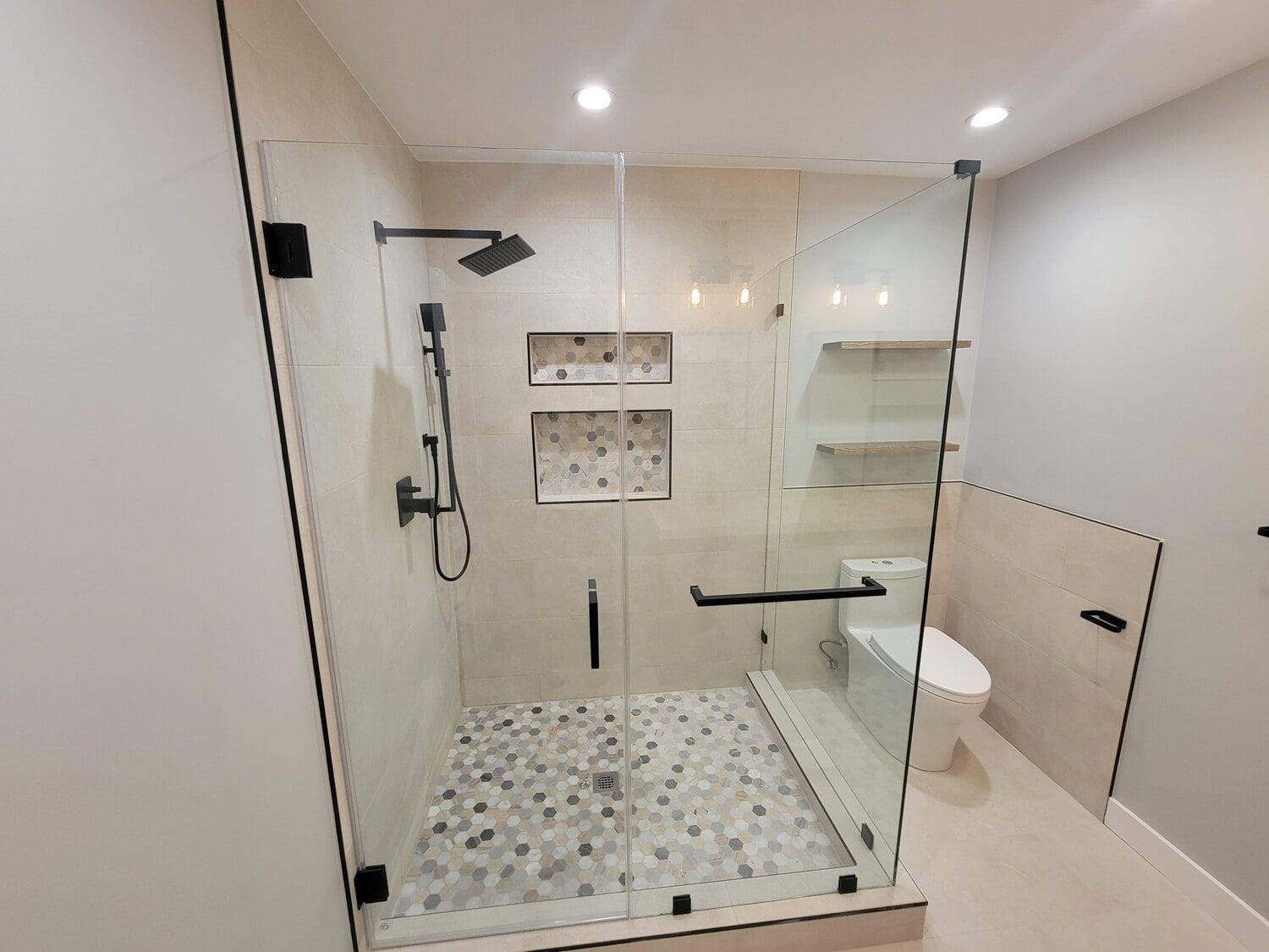 A bathroom with a shower and tiled floor