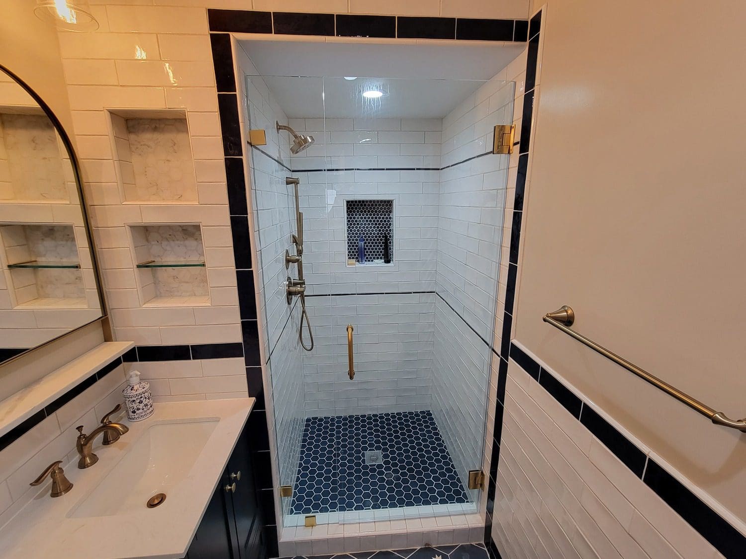 A bathroom with a shower and tub in it