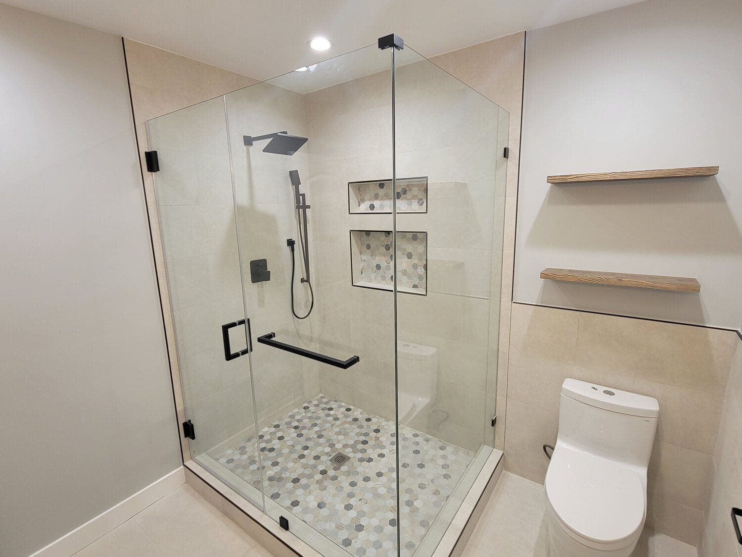 A bathroom with a shower and toilet in it