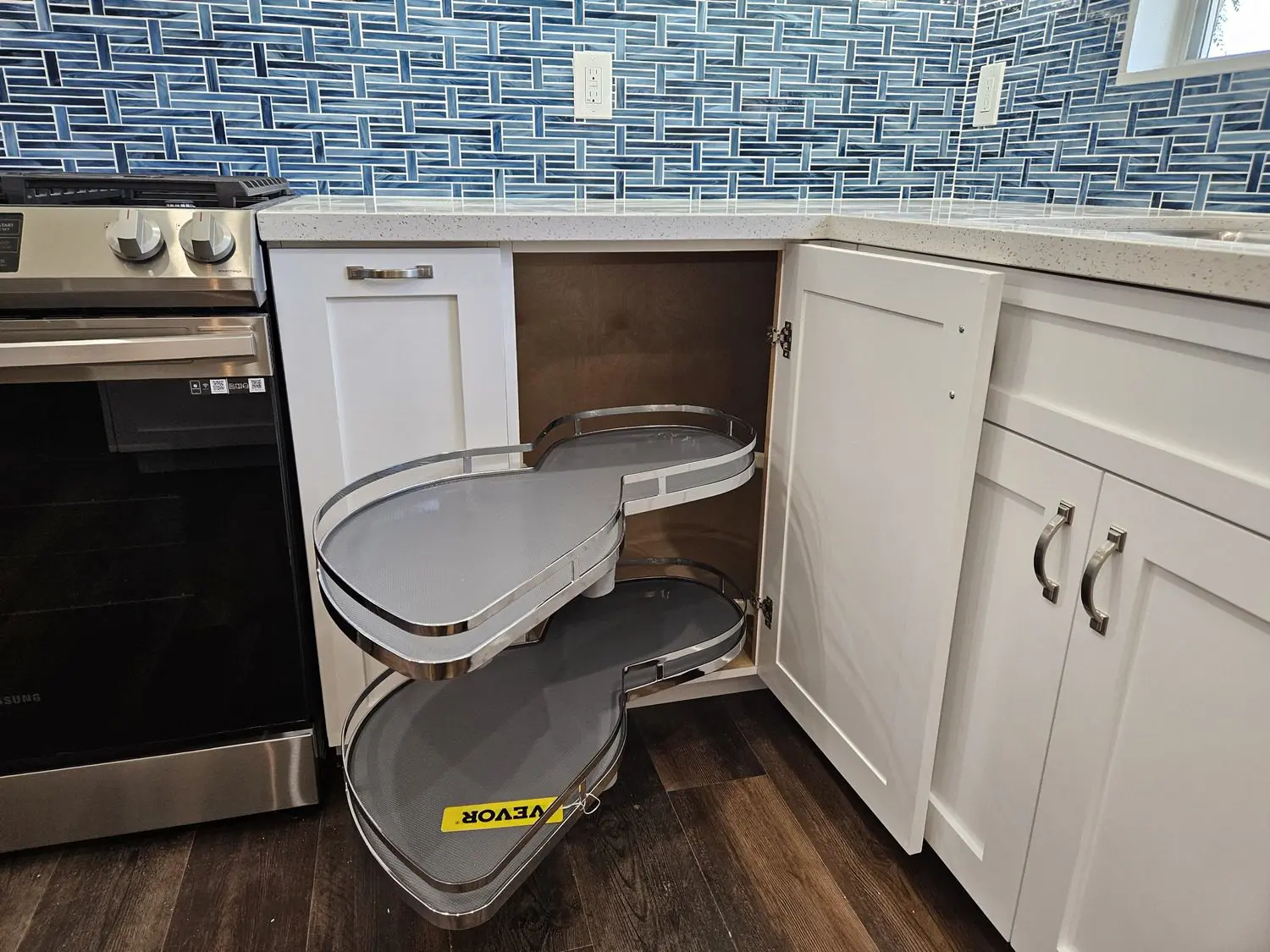 A kitchen with a stove and cabinets in it