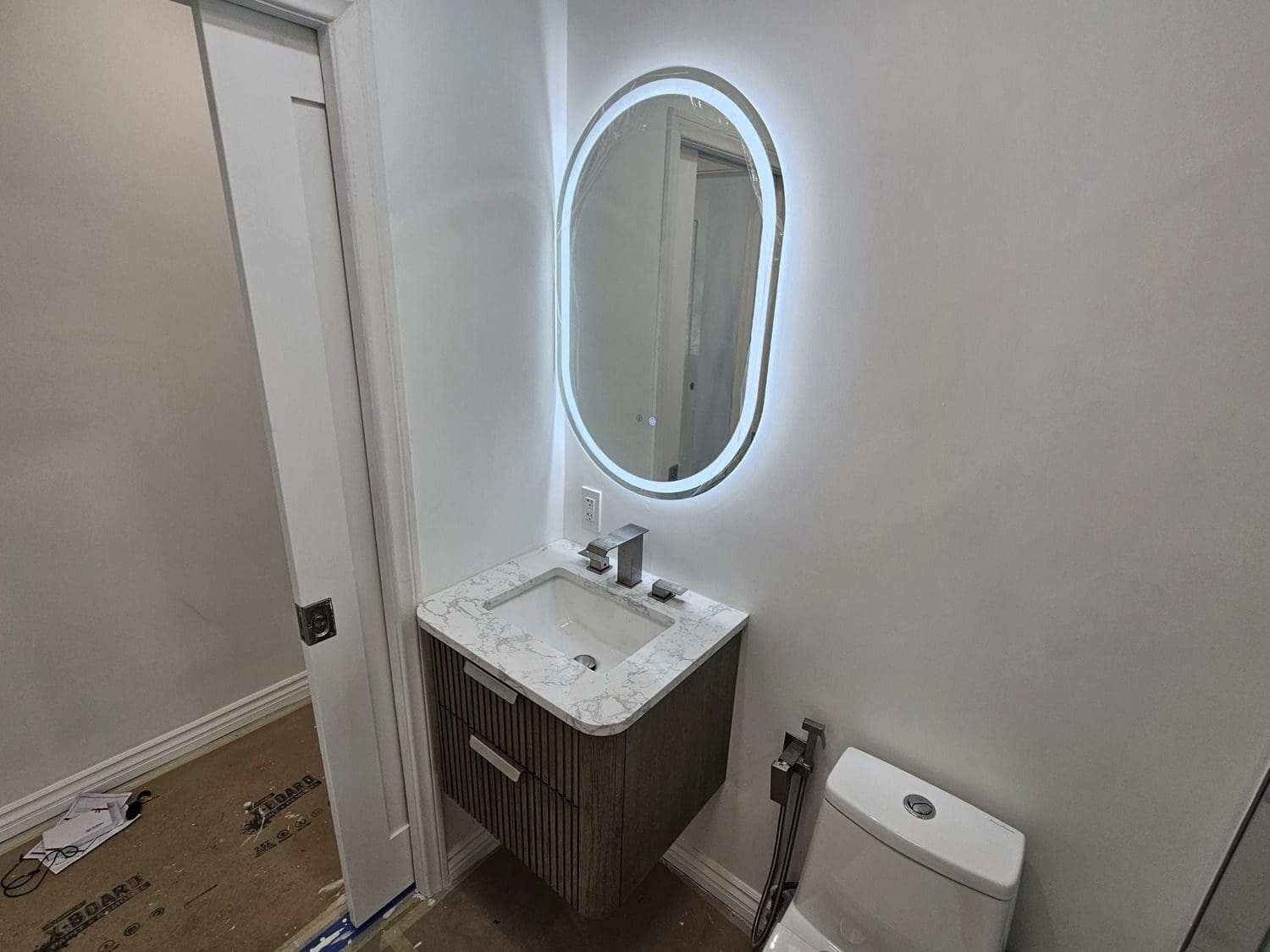 A bathroom with a toilet and sink in it