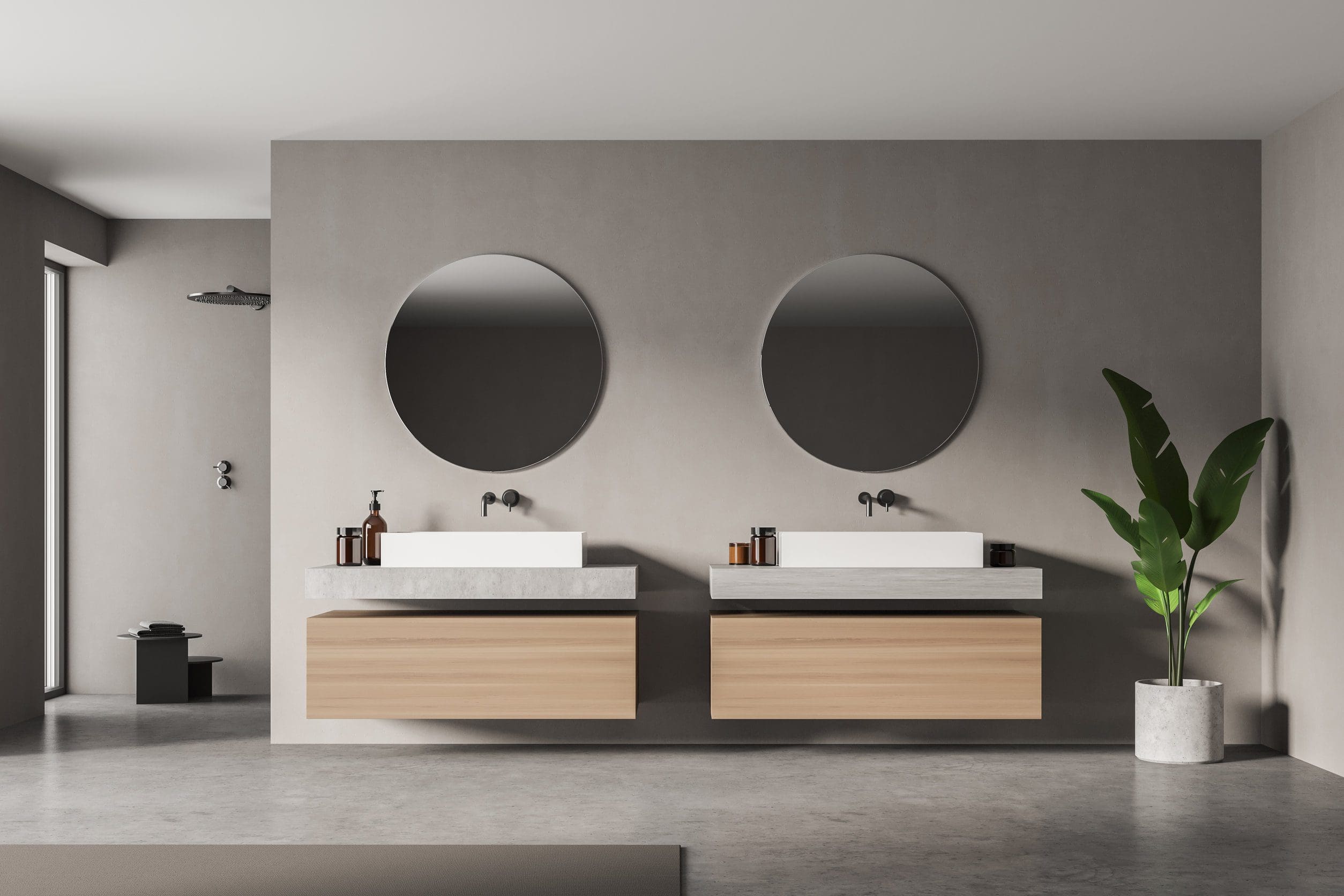 A couple of mirrors and two sinks in a room.