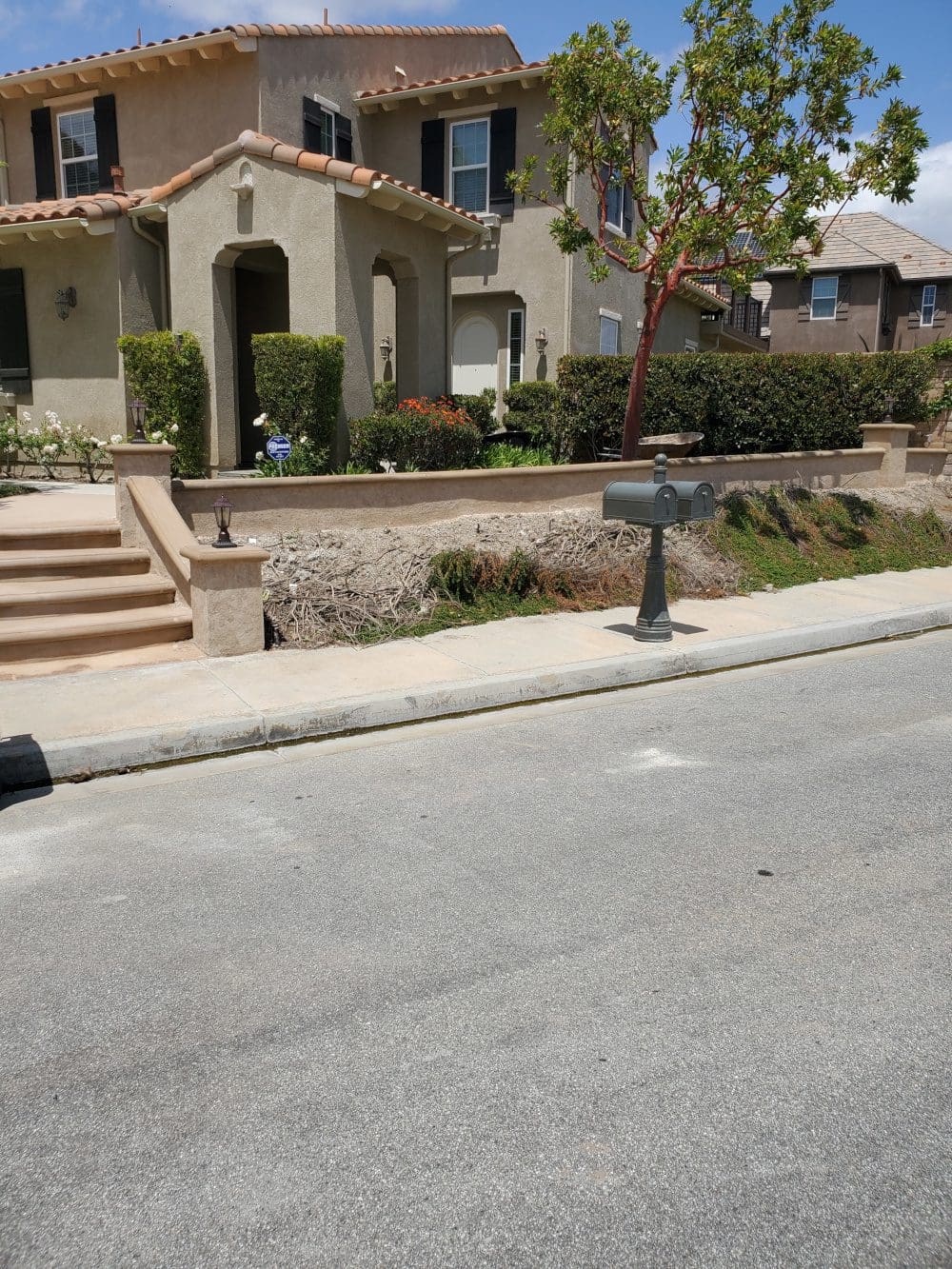 A street with a parking meter and some steps