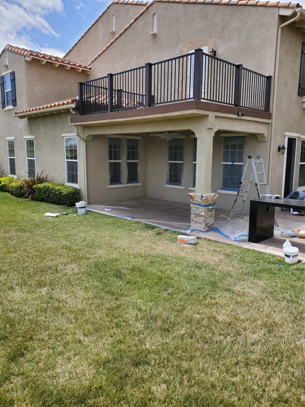 A house with a patio and deck in it