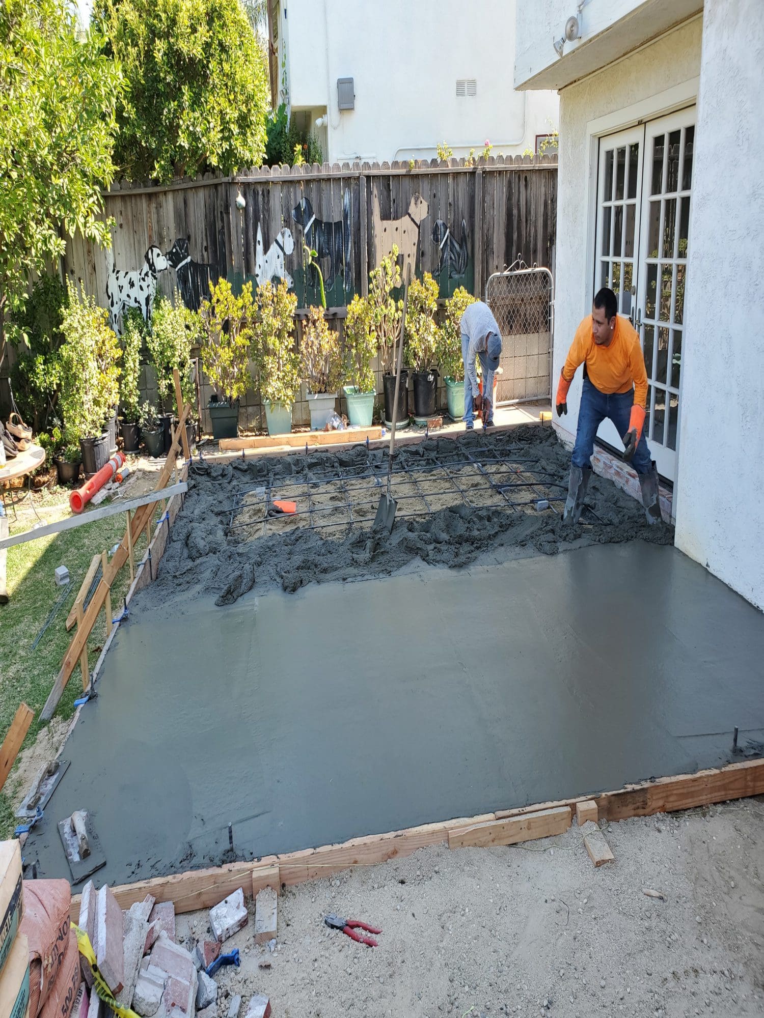 A man standing on top of cement slab.