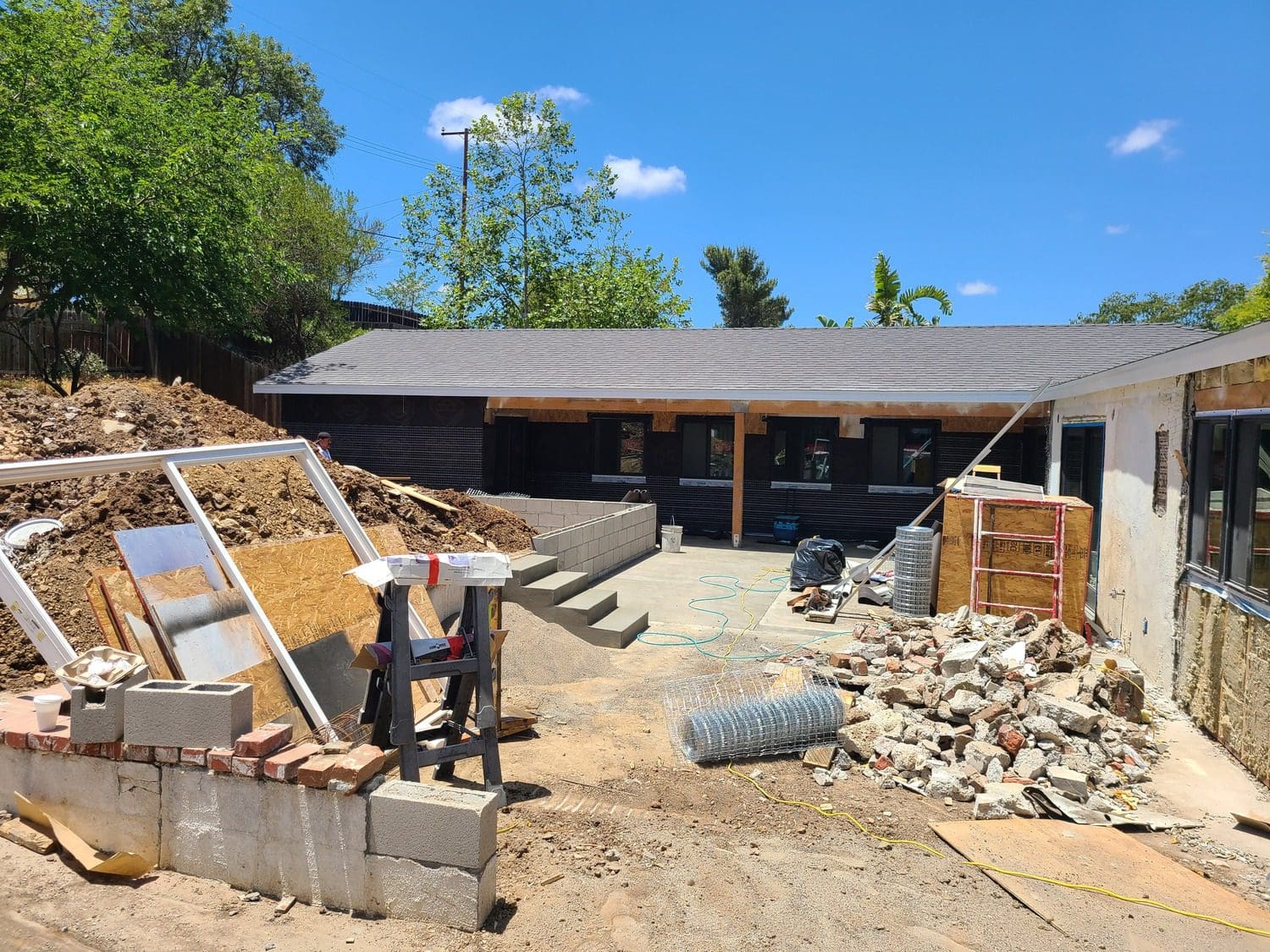 A house that is being remodeled with rubble.