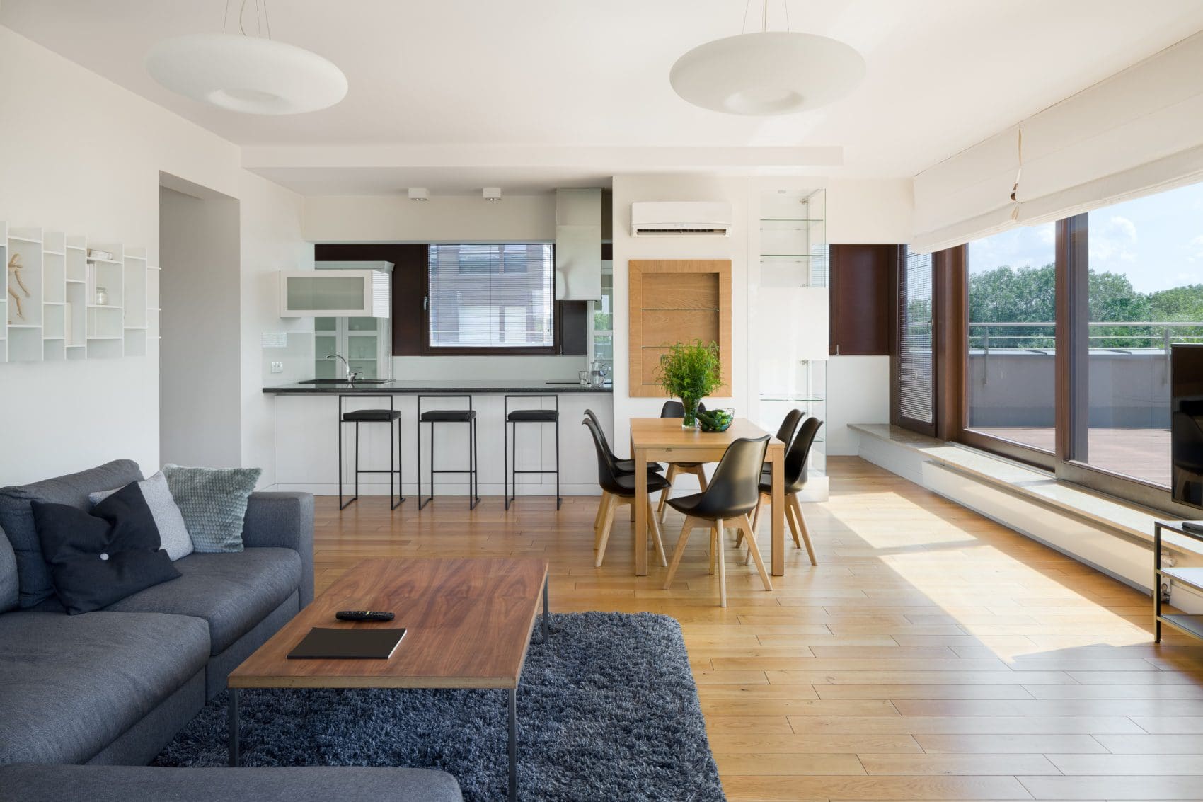 A living room with a table and chairs in it