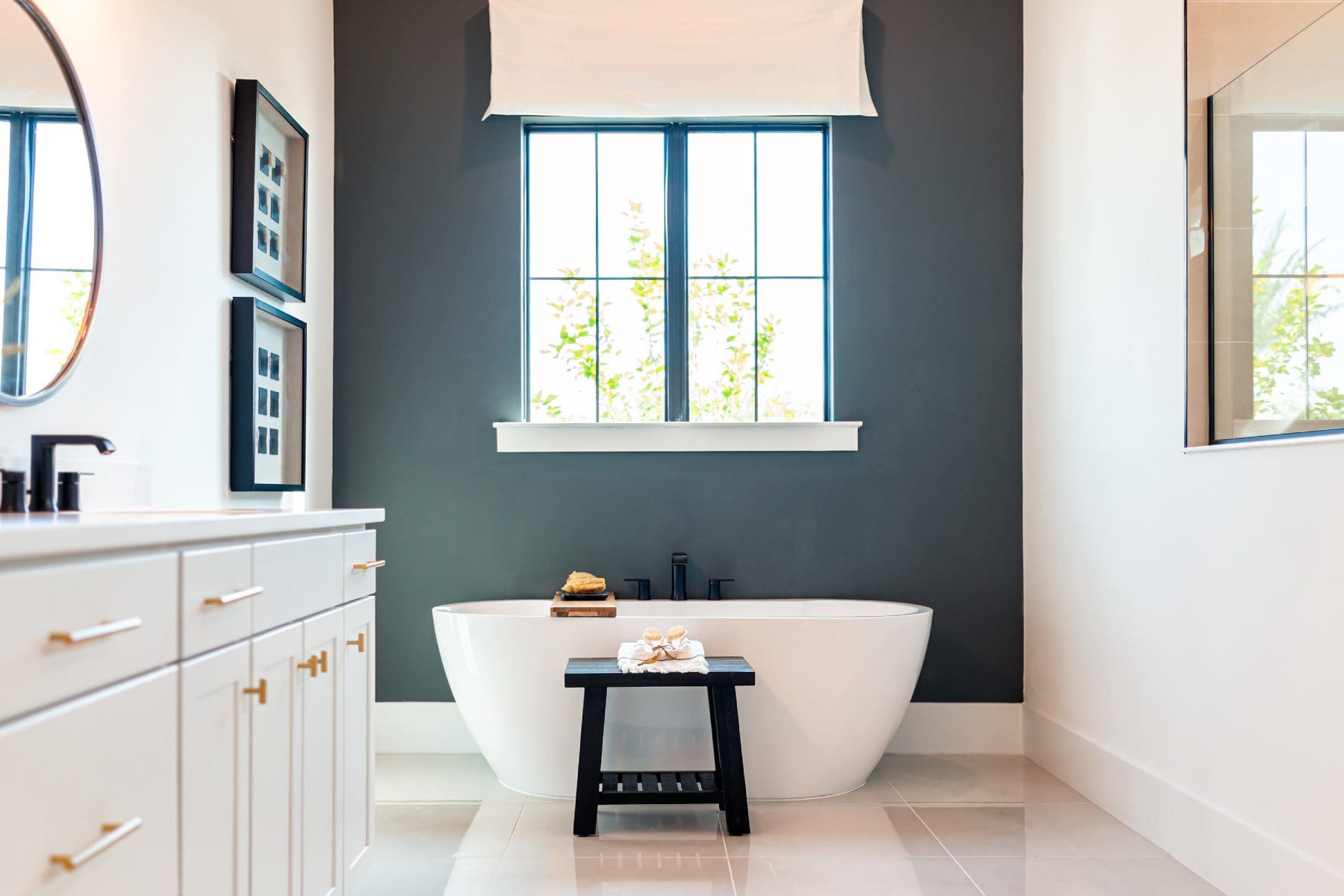 A bathroom with a tub and window in it