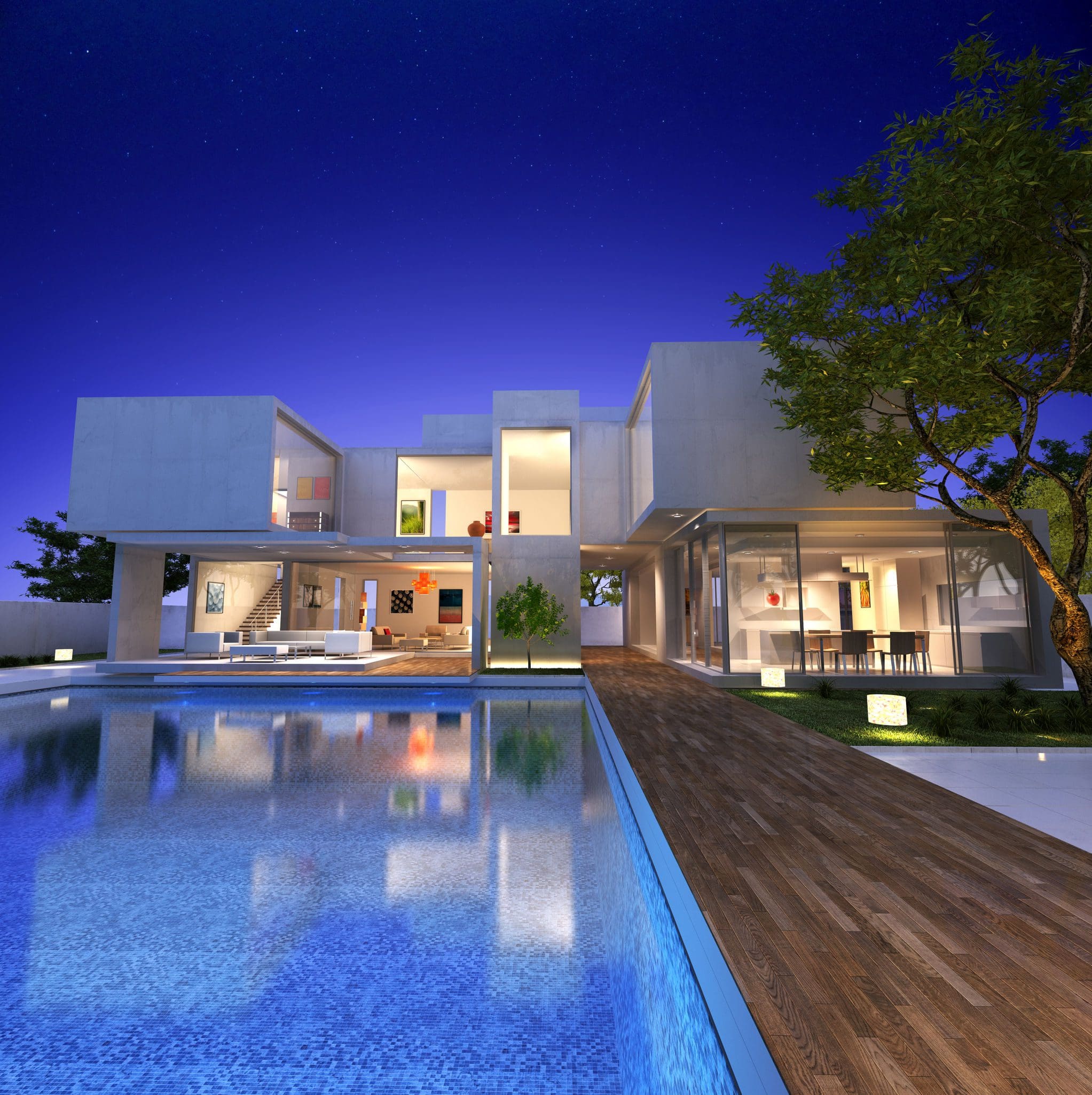 A large pool in front of a house at night.